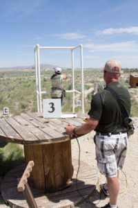Photo shows Corey Glennon and Courtney Murphy from Canyon Construction shooting clays